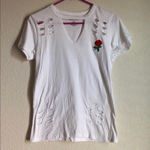 White t-shirt with v neck with collar connected.